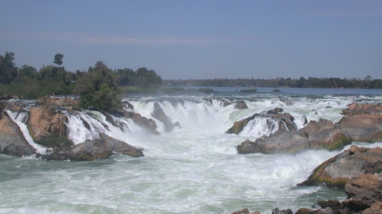 Group of short waterfalls in a horseshow shape.