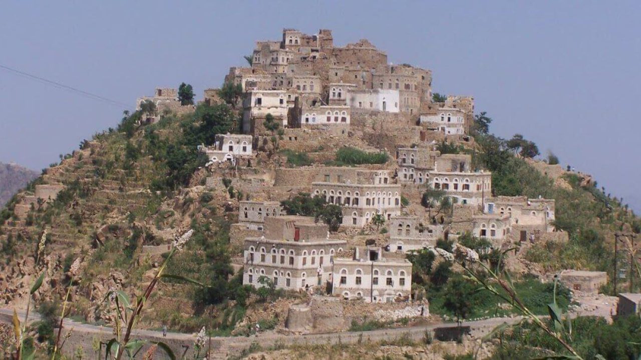Houses built along hillside.
