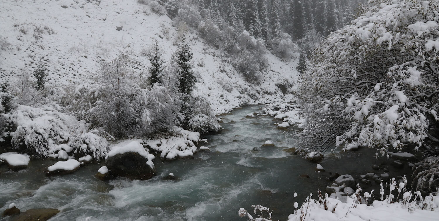 Stream, snowy banks.