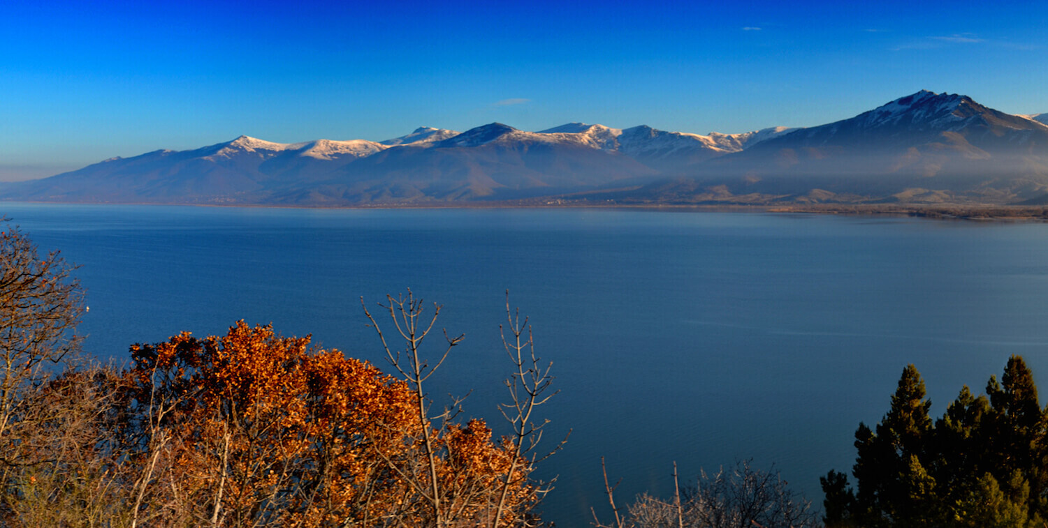 Lake with mountains in the background.