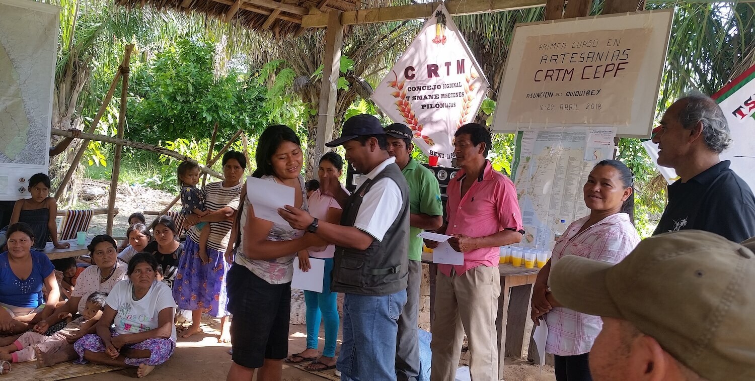 Woman receives certificate from man.